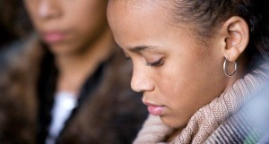 Grief: Sisters looking down introspectively