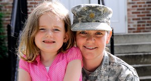 Deployments: Service member in uniform with her young daughter