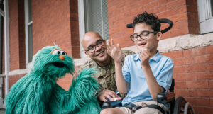 Rosita with a military parent and child.