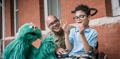 Rosita with a military parent and child.