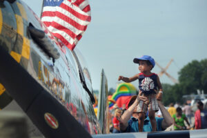 Child at a military parade.