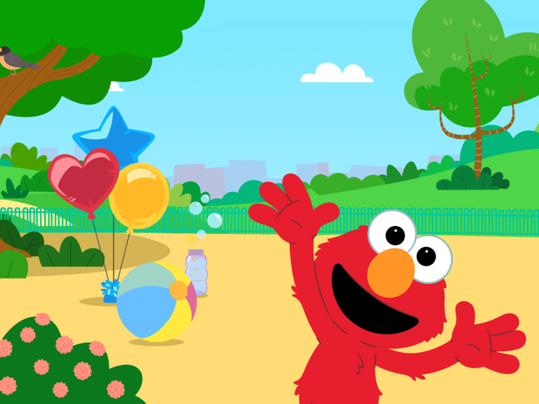 Elmo in a park.